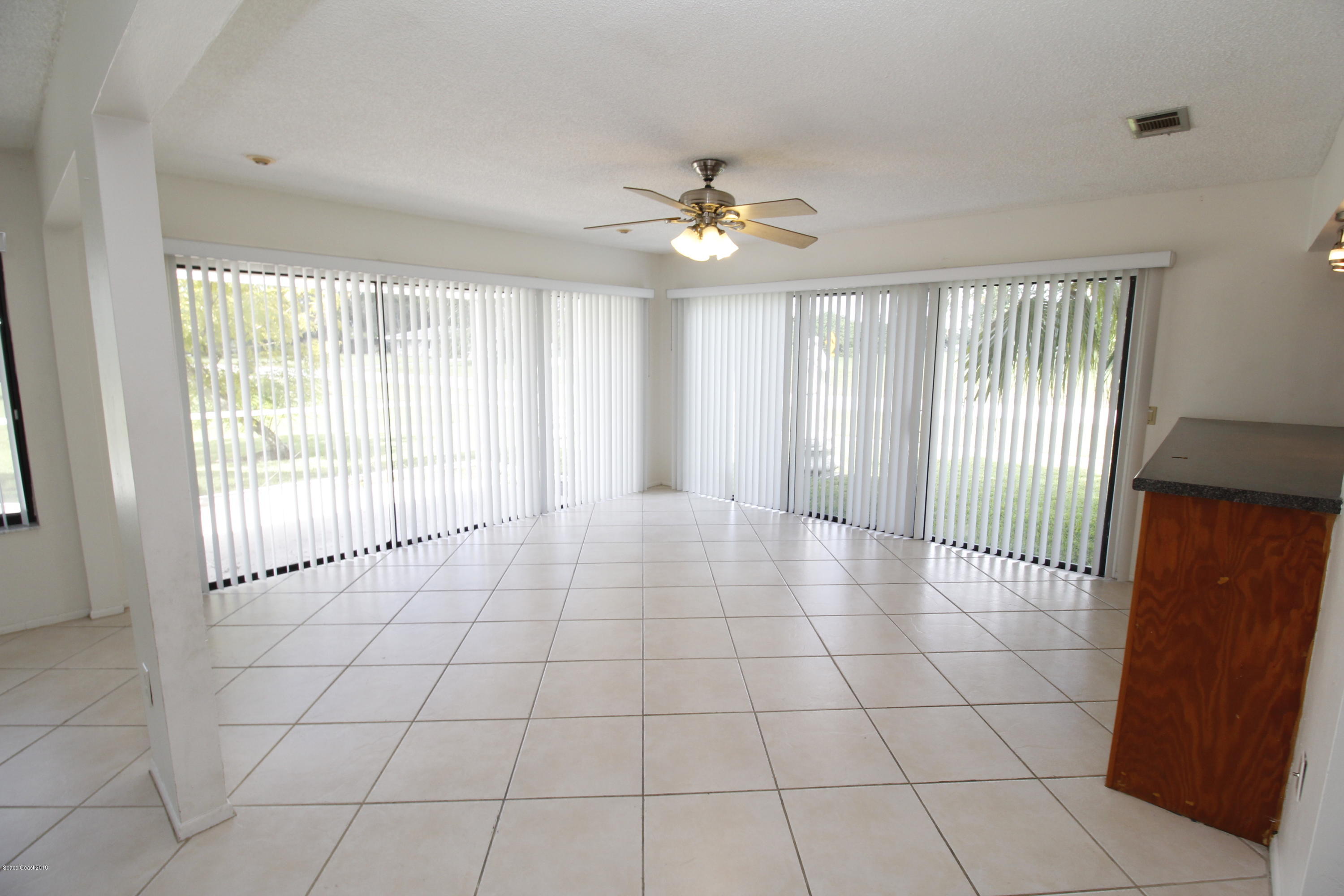 1302 Cherry Hills Road Northeast Palm Bay, FL 32905 - Photo 19 of 24 a view of an empty room with a window