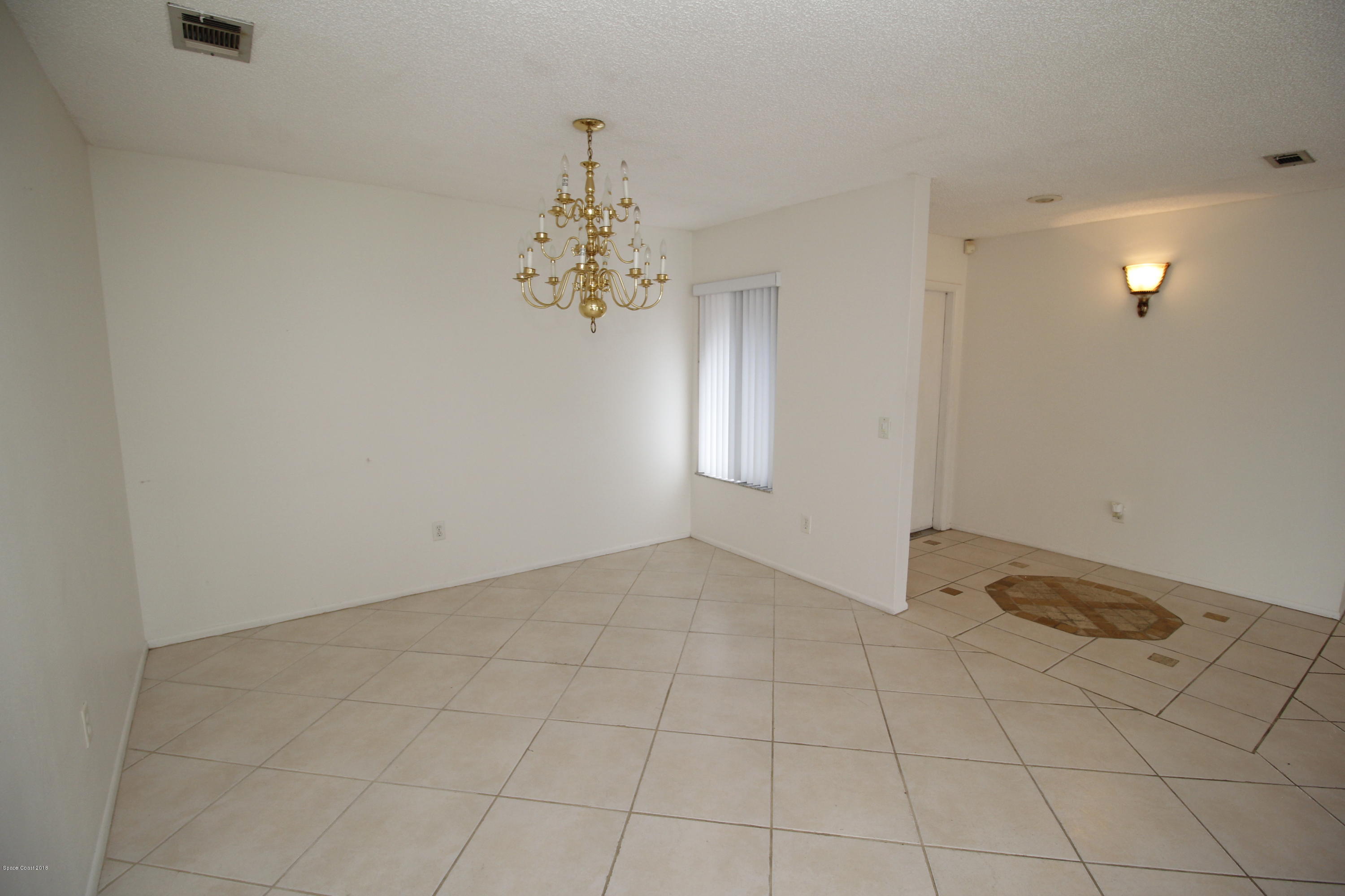 1302 Cherry Hills Road Northeast Palm Bay, FL 32905 - Photo 20 of 24 an empty room with a empty space