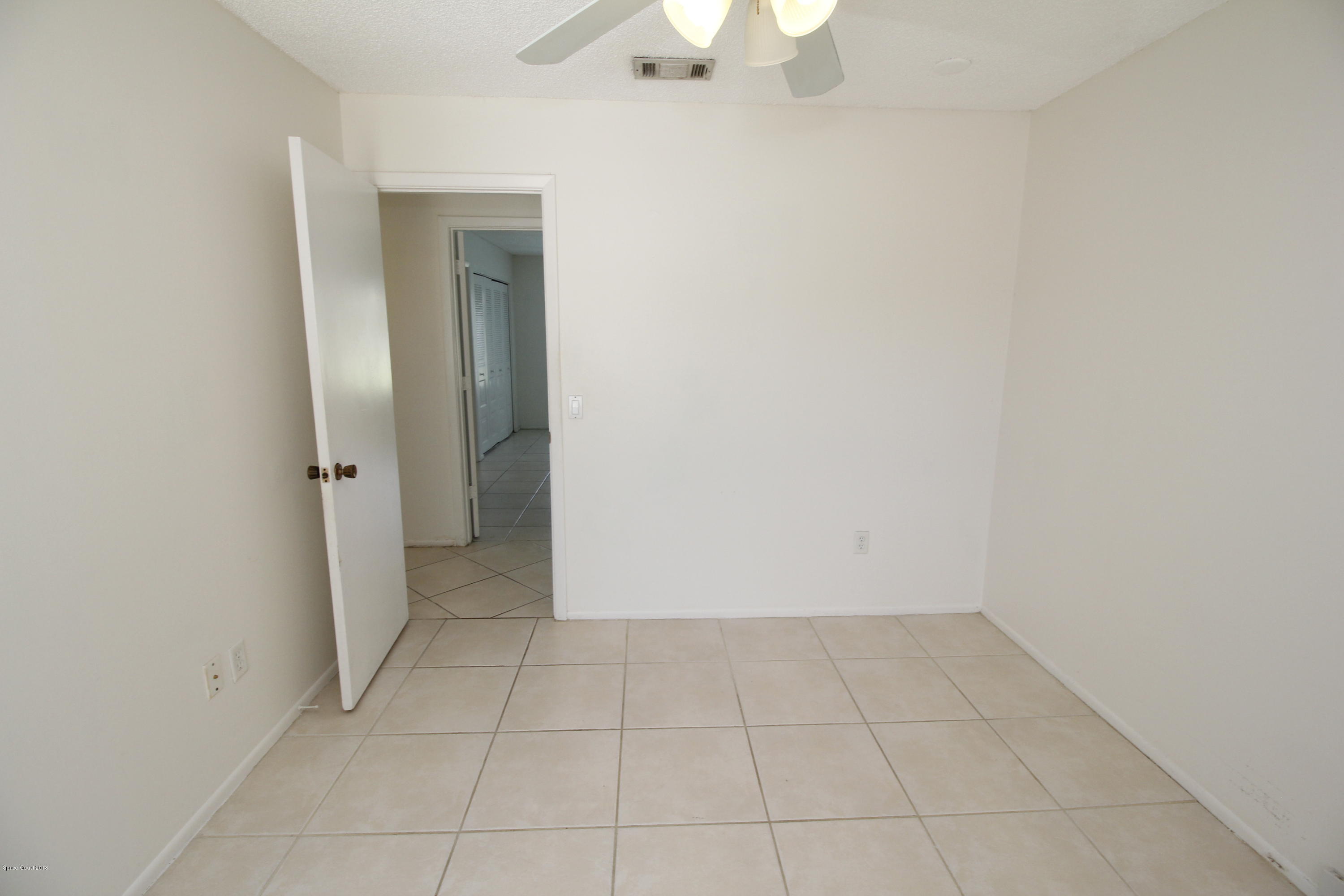 1302 Cherry Hills Road Northeast Palm Bay, FL 32905 - Photo 24 of 24 an empty room with a bathroom