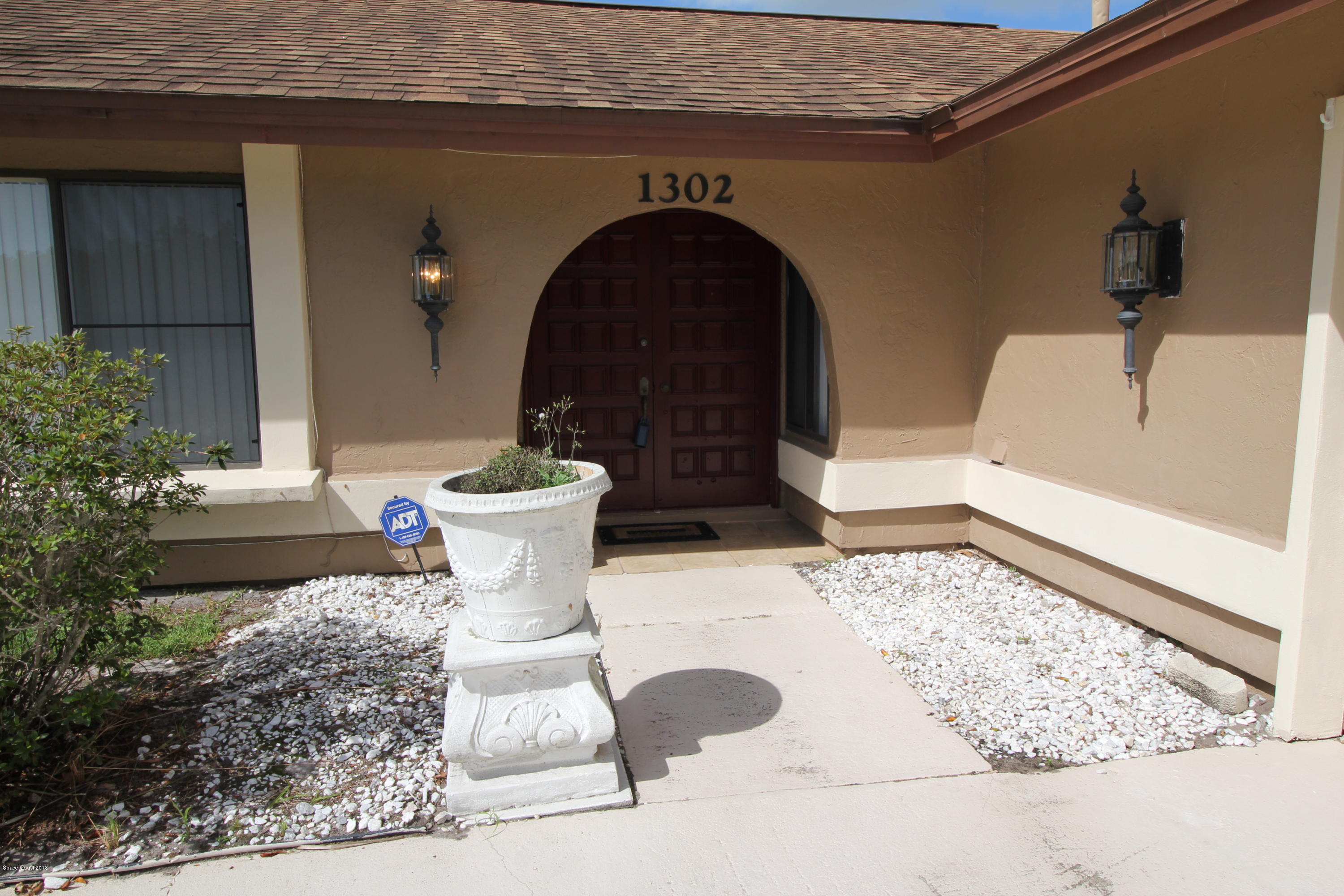1302 Cherry Hills Road Northeast Palm Bay, FL 32905 - Photo 4 of 24 a close view of a sink and a table in a patio