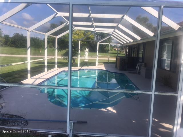1302 Cherry Hills Road Northeast Palm Bay, FL 32905 - Photo 9 of 24 a view of a backyard of a house