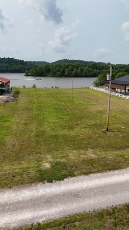 a view of a lake with houses in the back