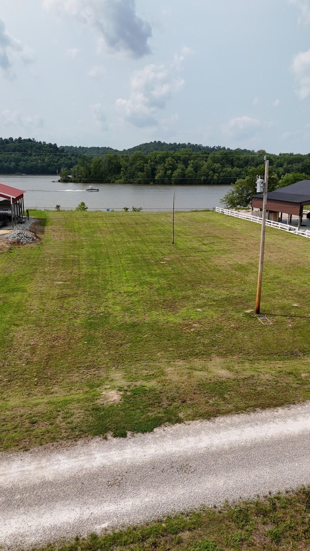 2623 Hardin Bottom River Road Clifton, TN 38425 - Photo 2 of 9 a view of a lake with houses in the back