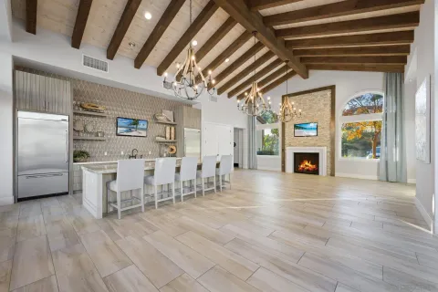 a kitchen with stainless steel appliances a refrigerator and a table