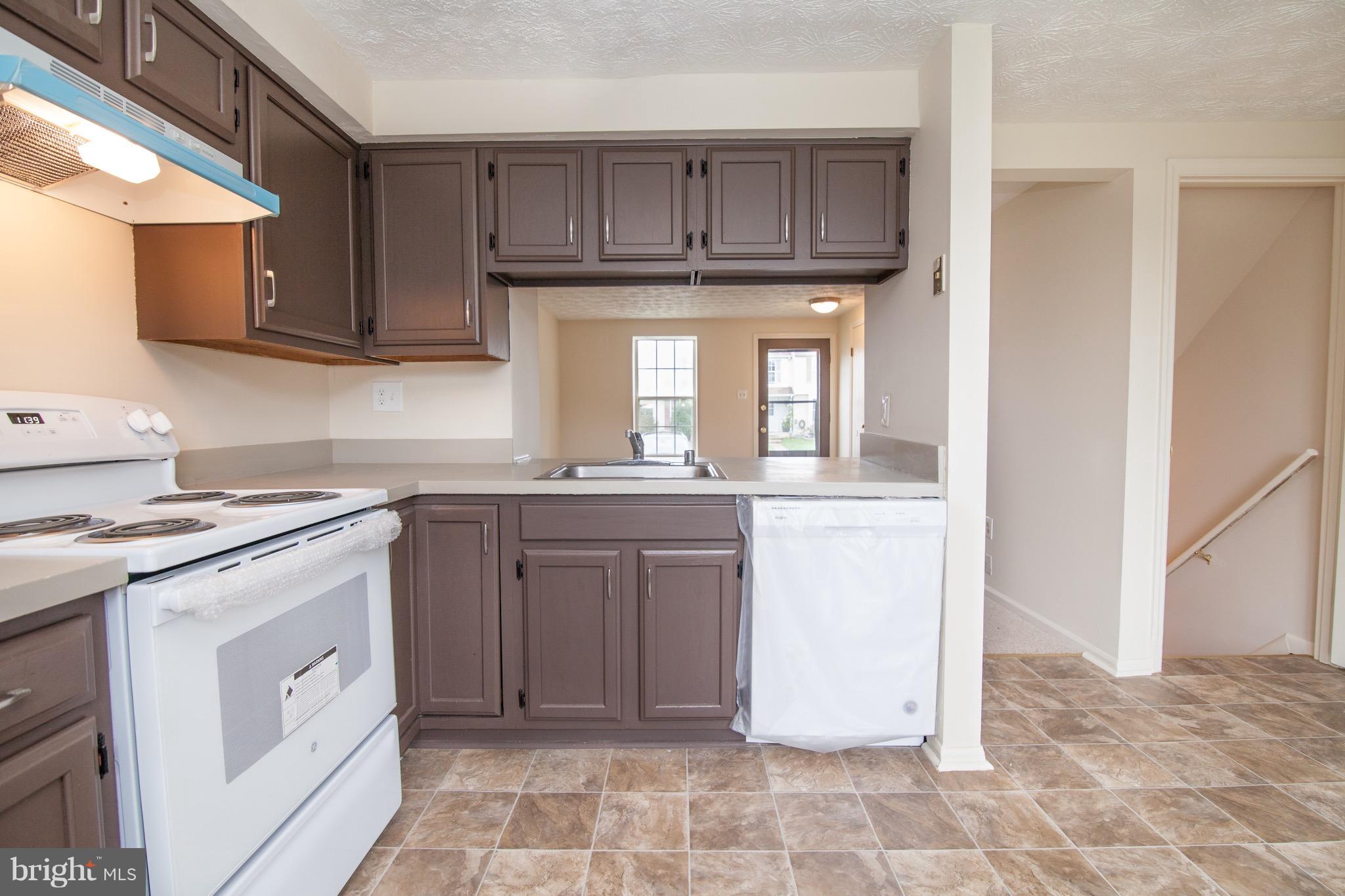 1319 Apple Ridge Court Edgewood, MD 21040 - Photo 3 of 23 a kitchen with a sink stove and cabinets