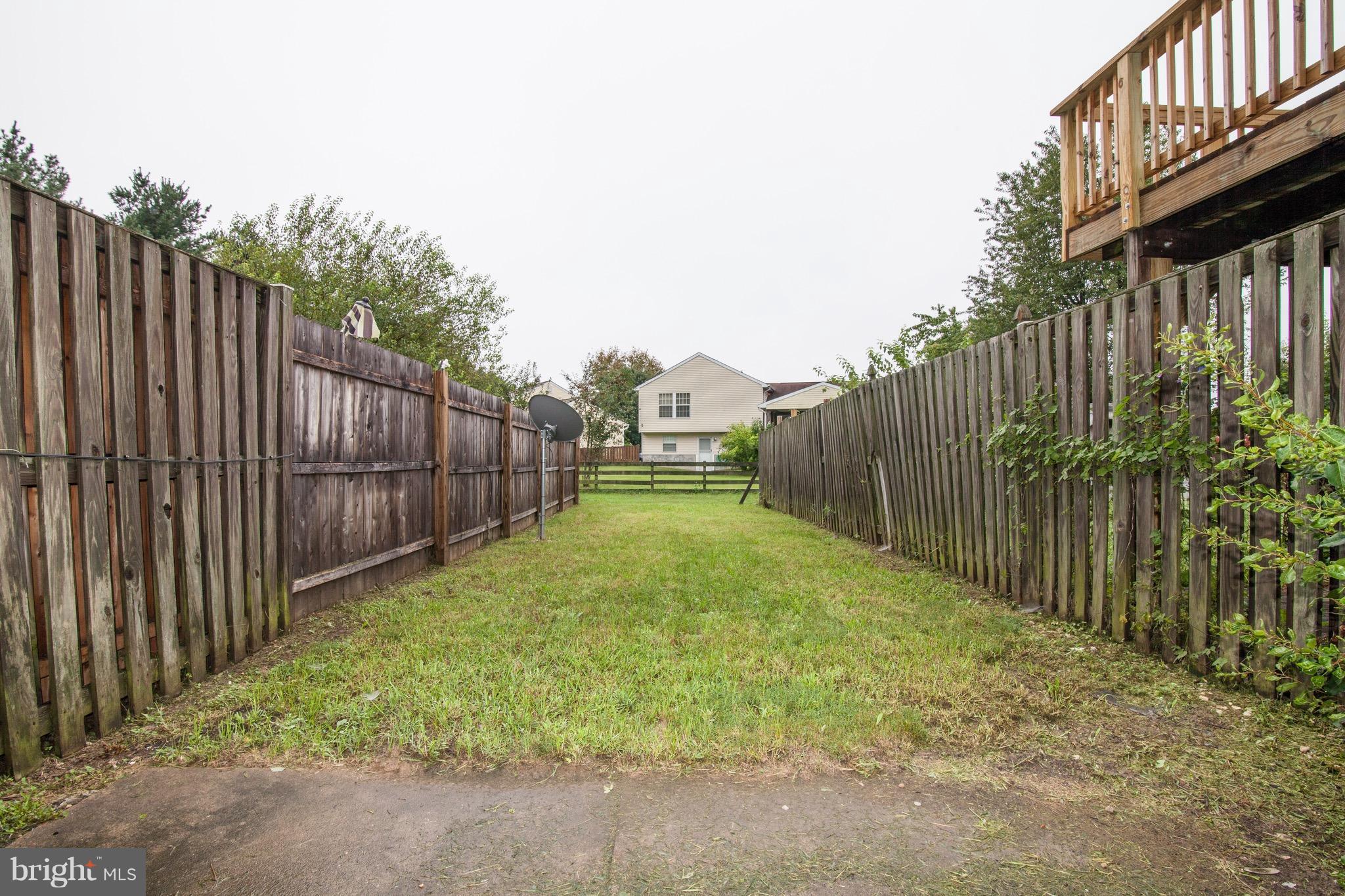 1319 Apple Ridge Court Edgewood, MD 21040 - Photo 22 of 23 a view of a backyard with wooden fence