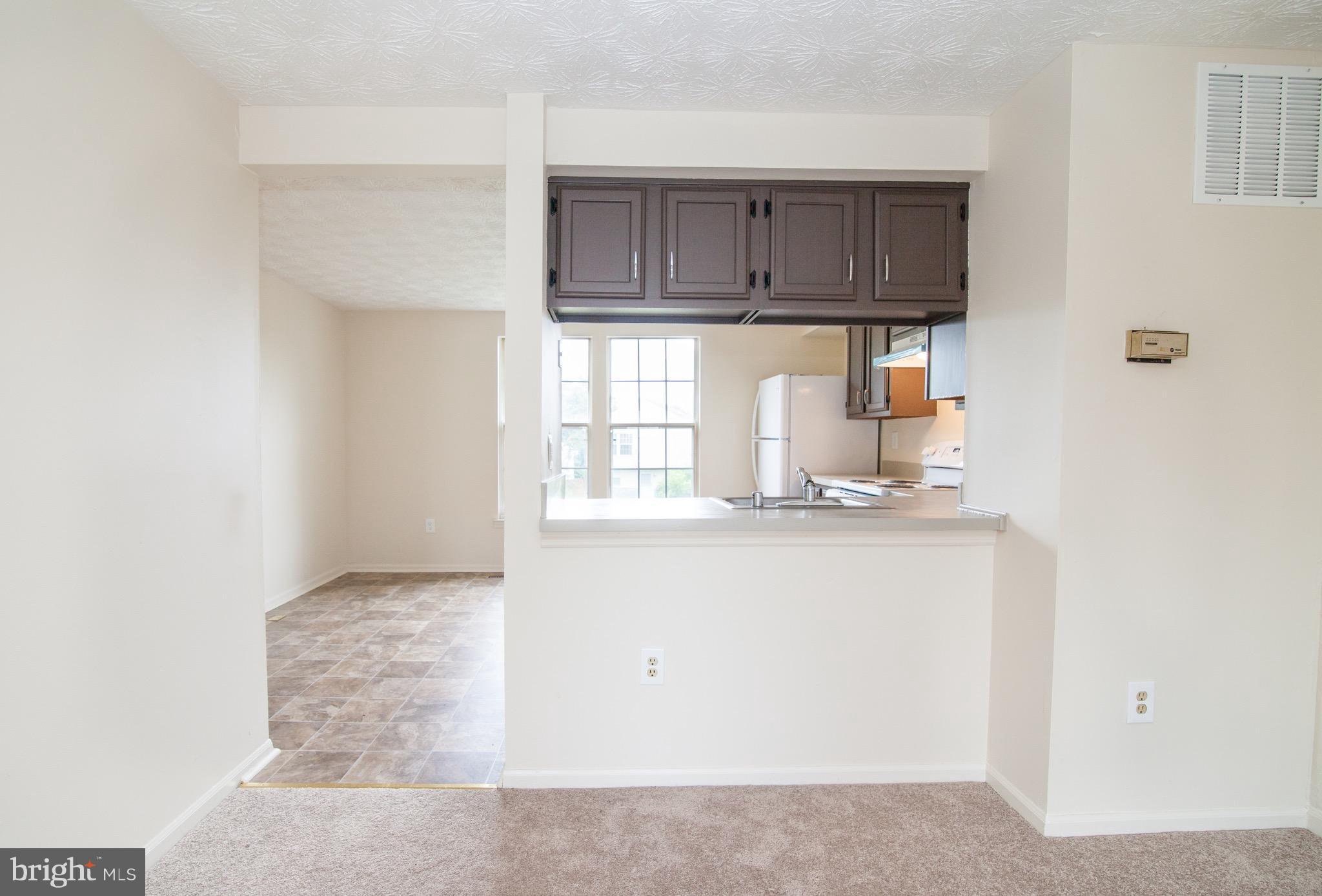 1319 Apple Ridge Court Edgewood, MD 21040 - Photo 6 of 23 a kitchen with granite countertop a sink a stove and cabinets