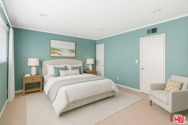 a bedroom with a bed and a couch