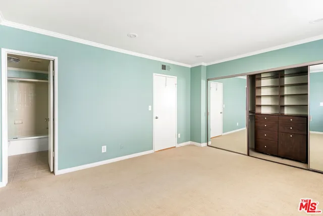 a bedroom with a bed and closet