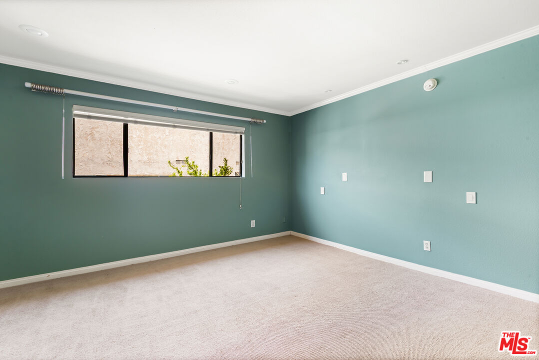10671 Wilkins Avenue, Unit 5 Los Angeles, CA 90024 - Photo 17 of 28 an empty room with windows and closet