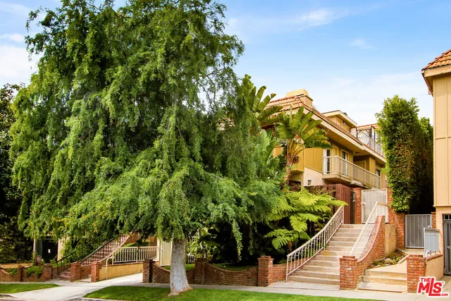 a view of a house with a tree park