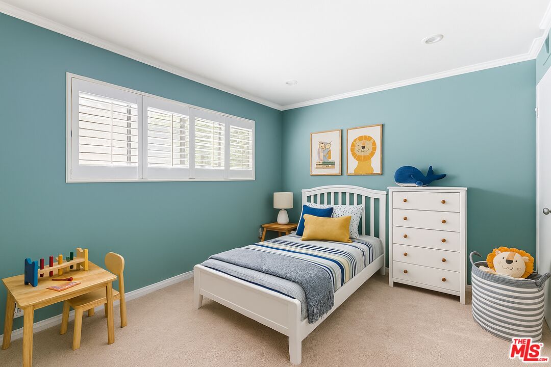 10671 Wilkins Avenue, Unit 5 Los Angeles, CA 90024 - Photo 21 of 28 a bedroom with a bed and a window