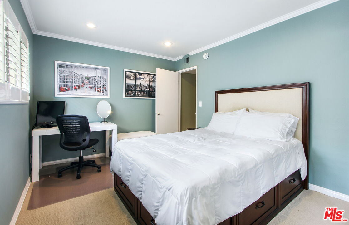 10671 Wilkins Avenue, Unit 5 Los Angeles, CA 90024 - Photo 22 of 28 a bedroom with a bed a desk and chair