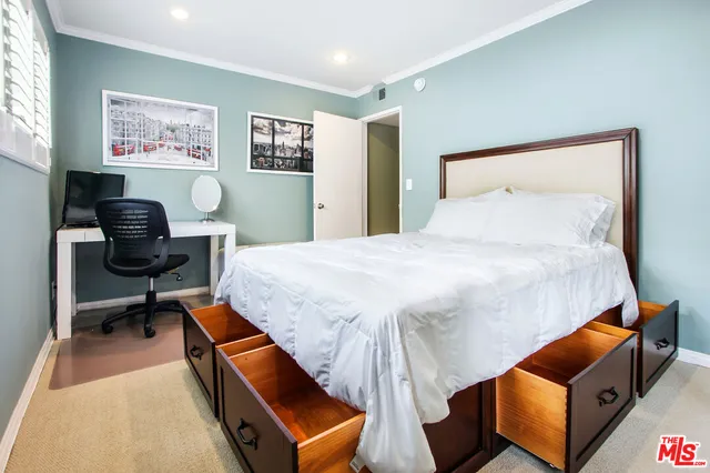 a bedroom with a bed and furniture