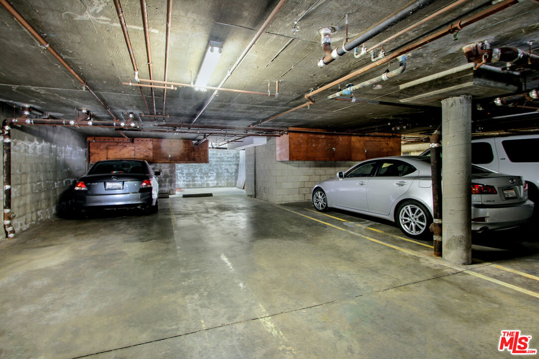 10671 Wilkins Avenue, Unit 5 Los Angeles, CA 90024 - Photo 27 of 28 a view of parking garage with cars parked