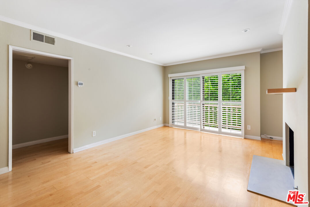 10671 Wilkins Avenue, Unit 5 Los Angeles, CA 90024 - Photo 4 of 28 a view of an empty room with glass door