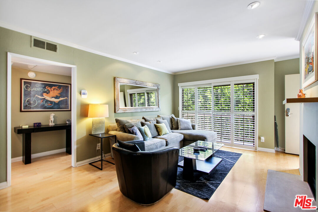10671 Wilkins Avenue, Unit 5 Los Angeles, CA 90024 - Photo 5 of 28 a living room with furniture and a flat screen tv