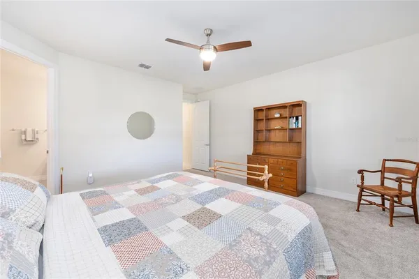 a bedroom with a bed and a cabinets