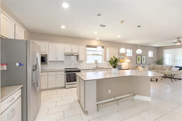 a kitchen with counter top space and appliances