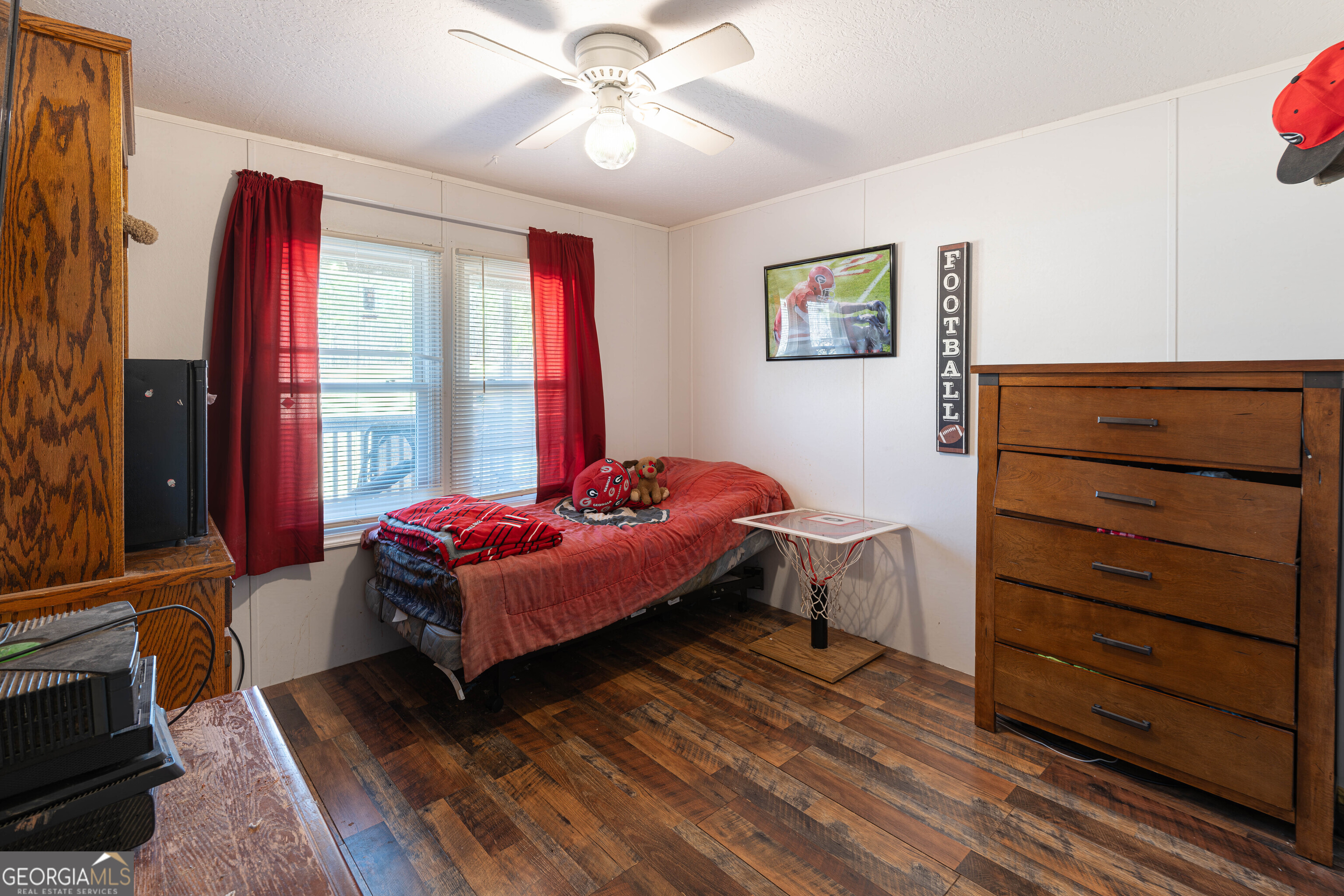 161 Cherokee Trail Forsyth, GA 31029 - Photo 21 of 32 a bedroom with a bed and wooden floor