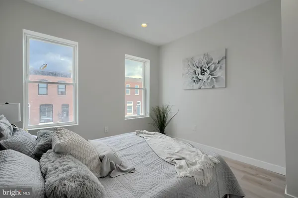 a bedroom with bed and window