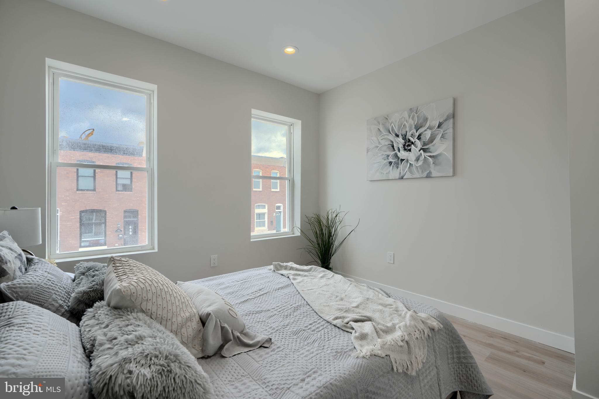 602 South Streeper Street Baltimore, MD 21224 - Photo 11 of 31 a bedroom with bed and window