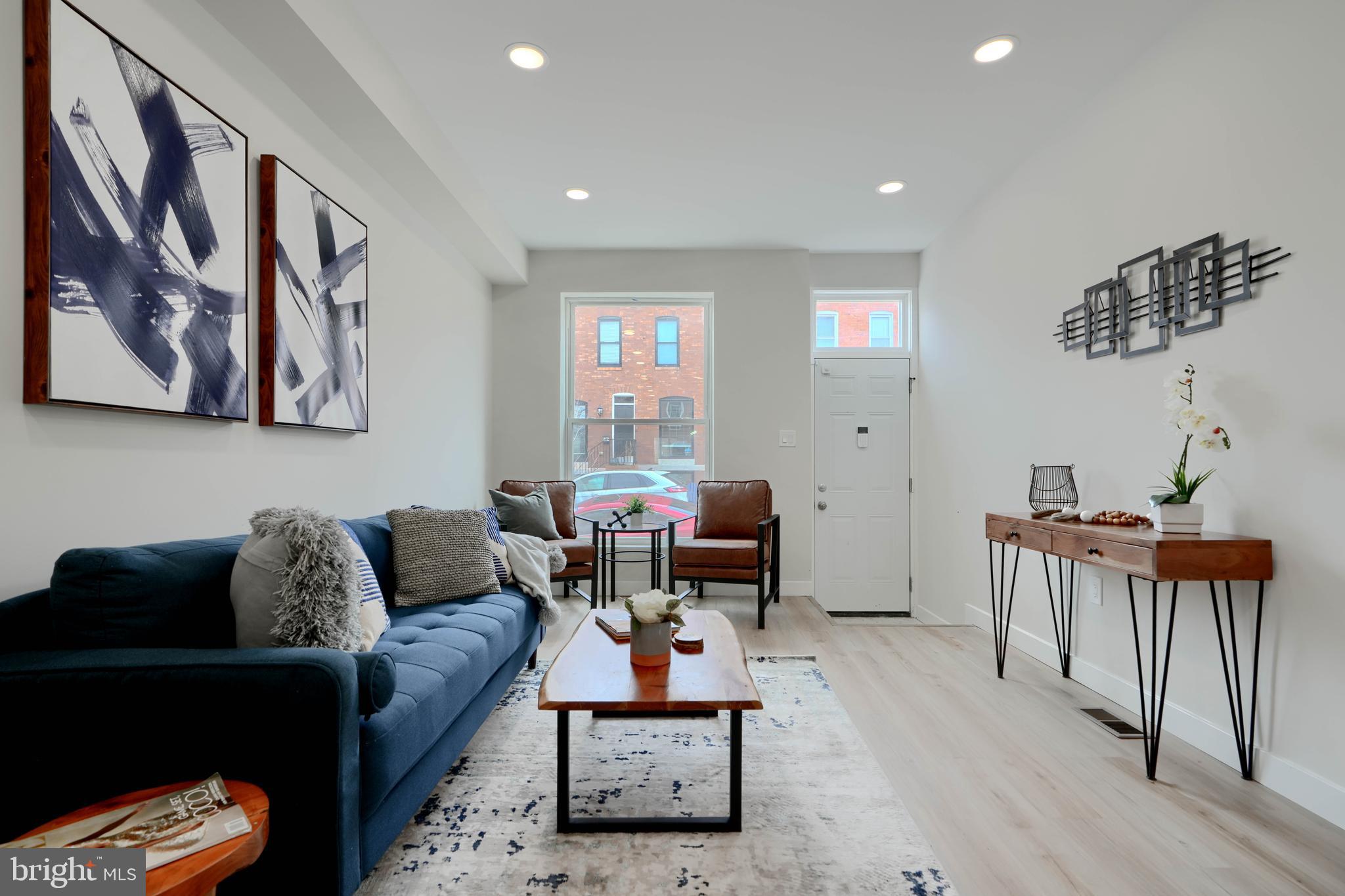 602 South Streeper Street Baltimore, MD 21224 - Photo 3 of 31 a living room with furniture and wooden floor
