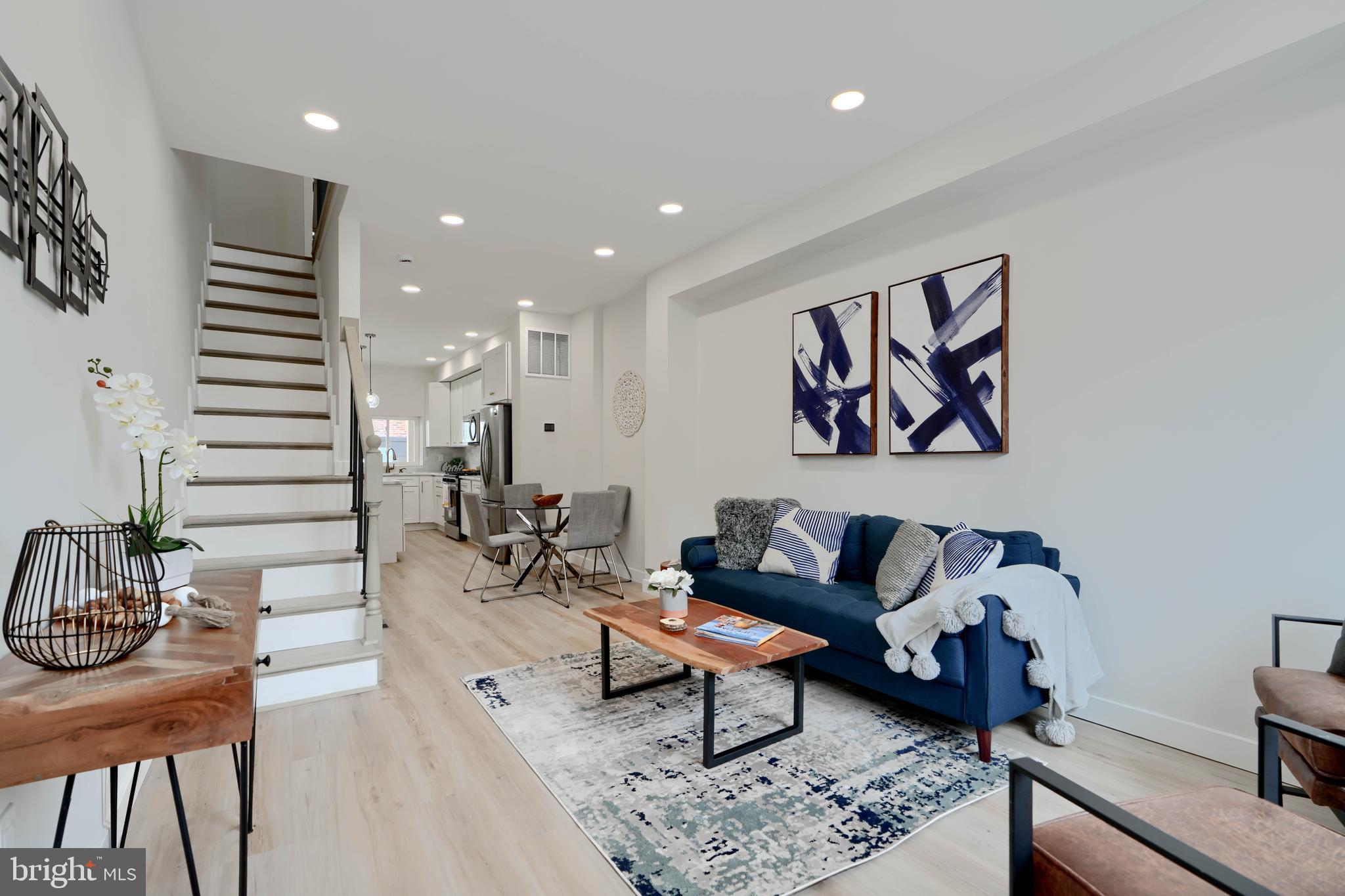 602 South Streeper Street Baltimore, MD 21224 - Photo 5 of 31 a living room with furniture and wooden floor