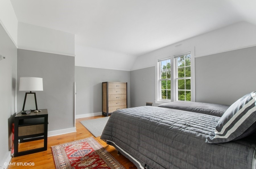 2404 Ridge Avenue Evanston, IL 60201 - Photo 16 of 24 a bedroom with a bed and a window