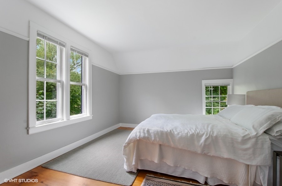 2404 Ridge Avenue Evanston, IL 60201 - Photo 17 of 24 a bed sitting in a bedroom next to a window