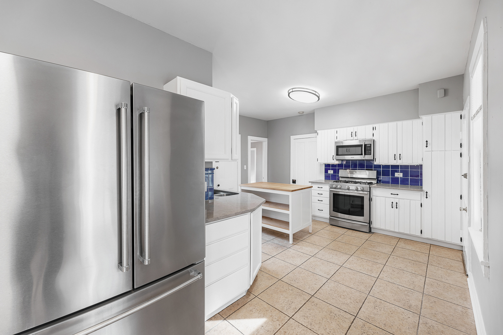 2404 Ridge Avenue Evanston, IL 60201 - Photo 3 of 24 a kitchen with stainless steel appliances a refrigerator sink and microwave