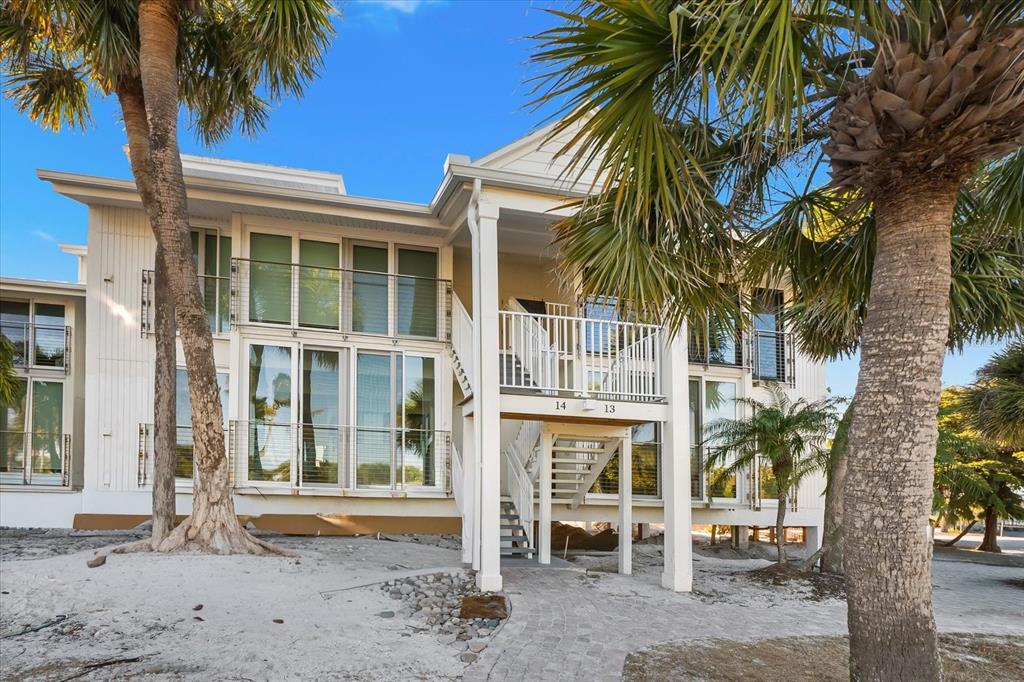 5000 Gasparilla Road, Unit 13A Boca Grande, FL 33921 - Photo 2 of 61 a front view of a house with a tree