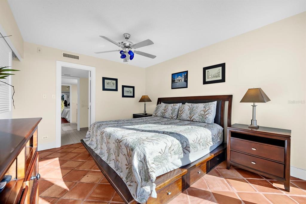 5000 Gasparilla Road, Unit 13A Boca Grande, FL 33921 - Photo 25 of 61 a bed room with a bed and a lamp