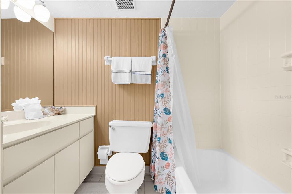 5000 Gasparilla Road, Unit 13A Boca Grande, FL 33921 - Photo 30 of 61 a white toilet sitting next to a bathroom sink