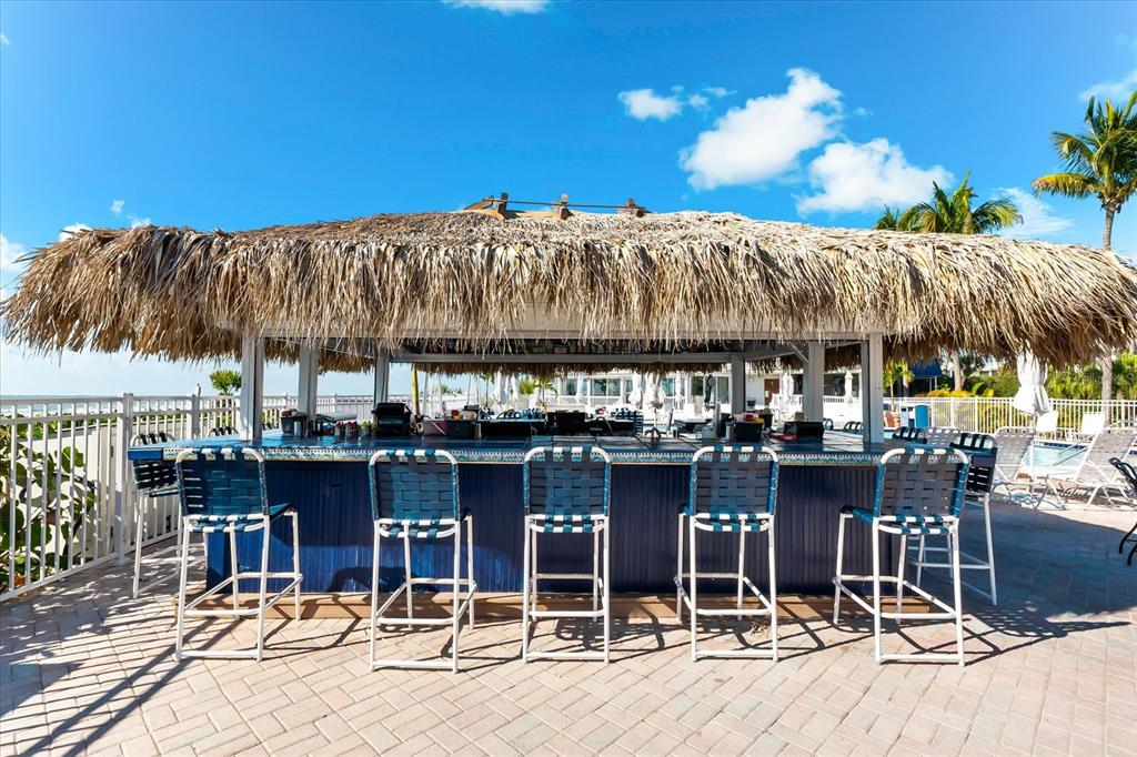 5000 Gasparilla Road, Unit 13A Boca Grande, FL 33921 - Photo 41 of 61 a view of dinning table and chairs in patio