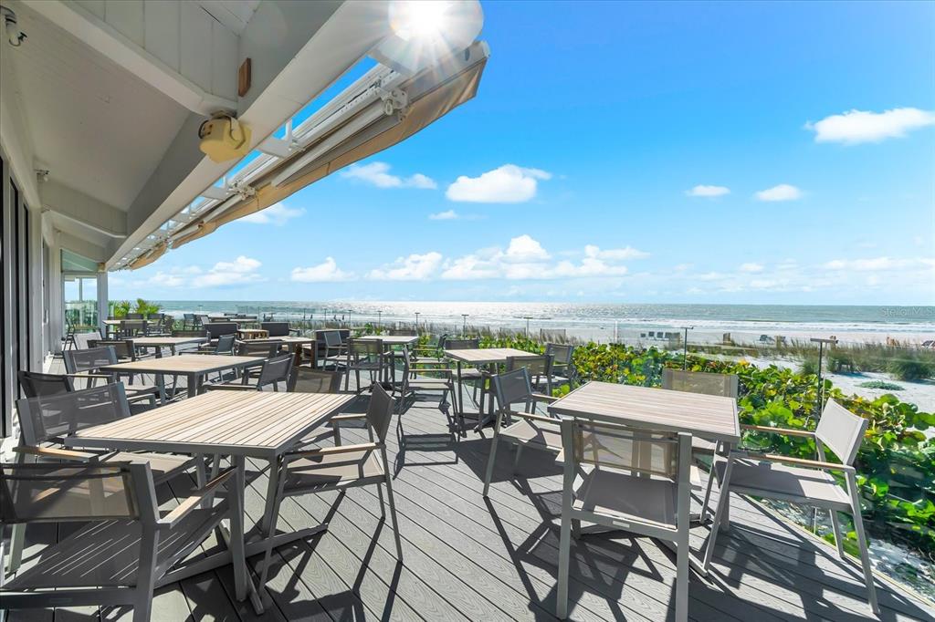5000 Gasparilla Road, Unit 13A Boca Grande, FL 33921 - Photo 45 of 61 a view of a terrace with furniture and a potted plant