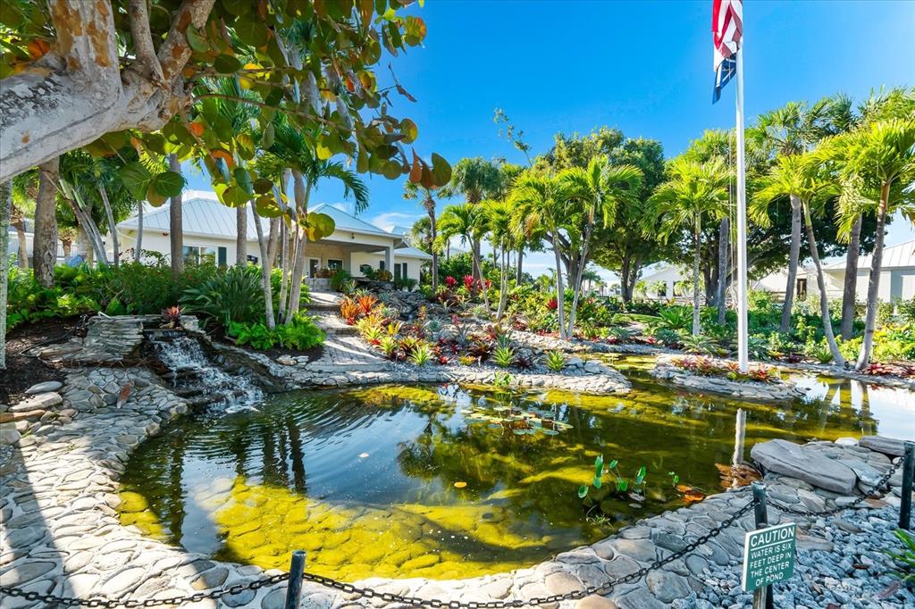 5000 Gasparilla Road, Unit 13A Boca Grande, FL 33921 - Photo 52 of 61 a view of swimming pool with lawn chairs and plants