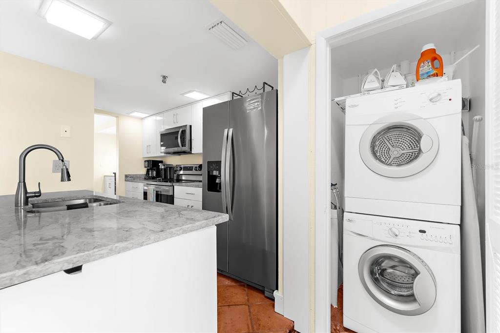 5000 Gasparilla Road, Unit 13A Boca Grande, FL 33921 - Photo 10 of 61 a utility room with sink dryer and washer