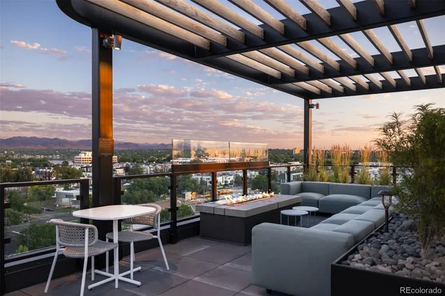 a balcony with furniture and outdoor view
