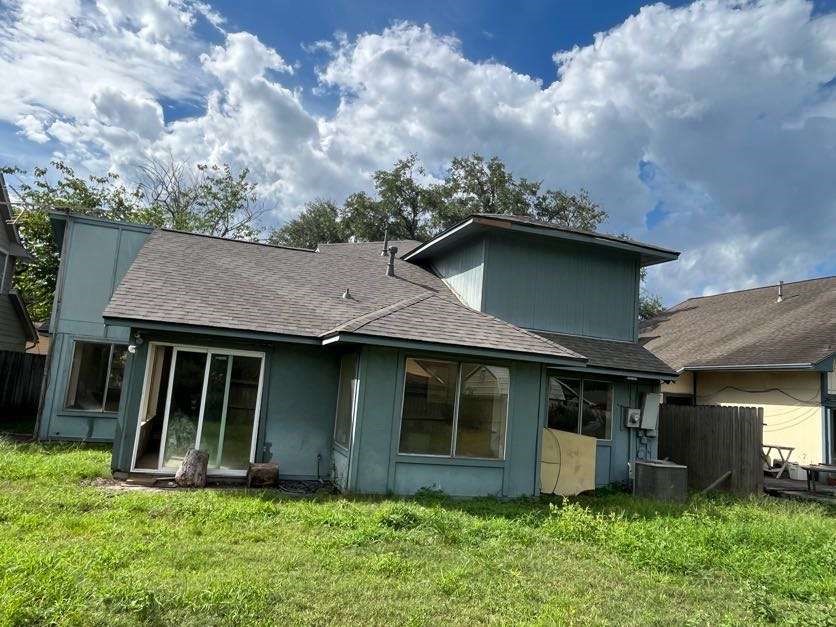 23827 Red Sky Drive Spring, TX 77373 - Photo 3 of 15 a view of a house with brick walls and a yard with potted plants