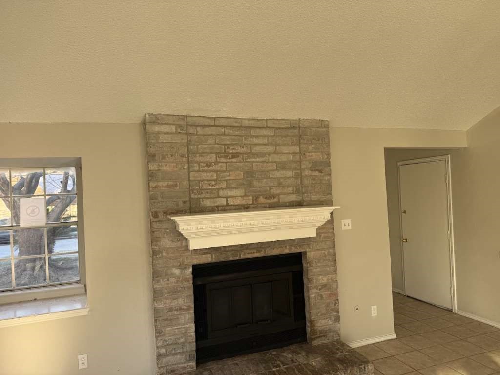 23827 Red Sky Drive Spring, TX 77373 - Photo 6 of 15 a view of an empty room with wooden floor and a fireplace