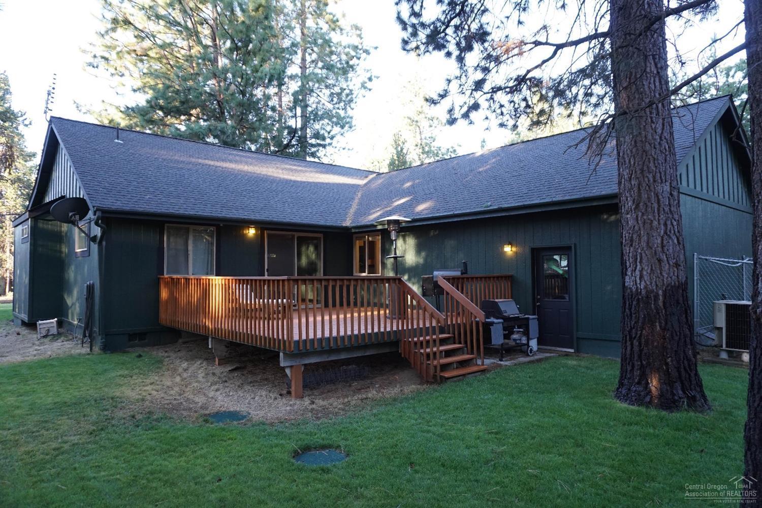 17000 Glendale Road Bend, OR 97707 - Photo 4 of 16 a view of a house with a yard porch and wooden fence