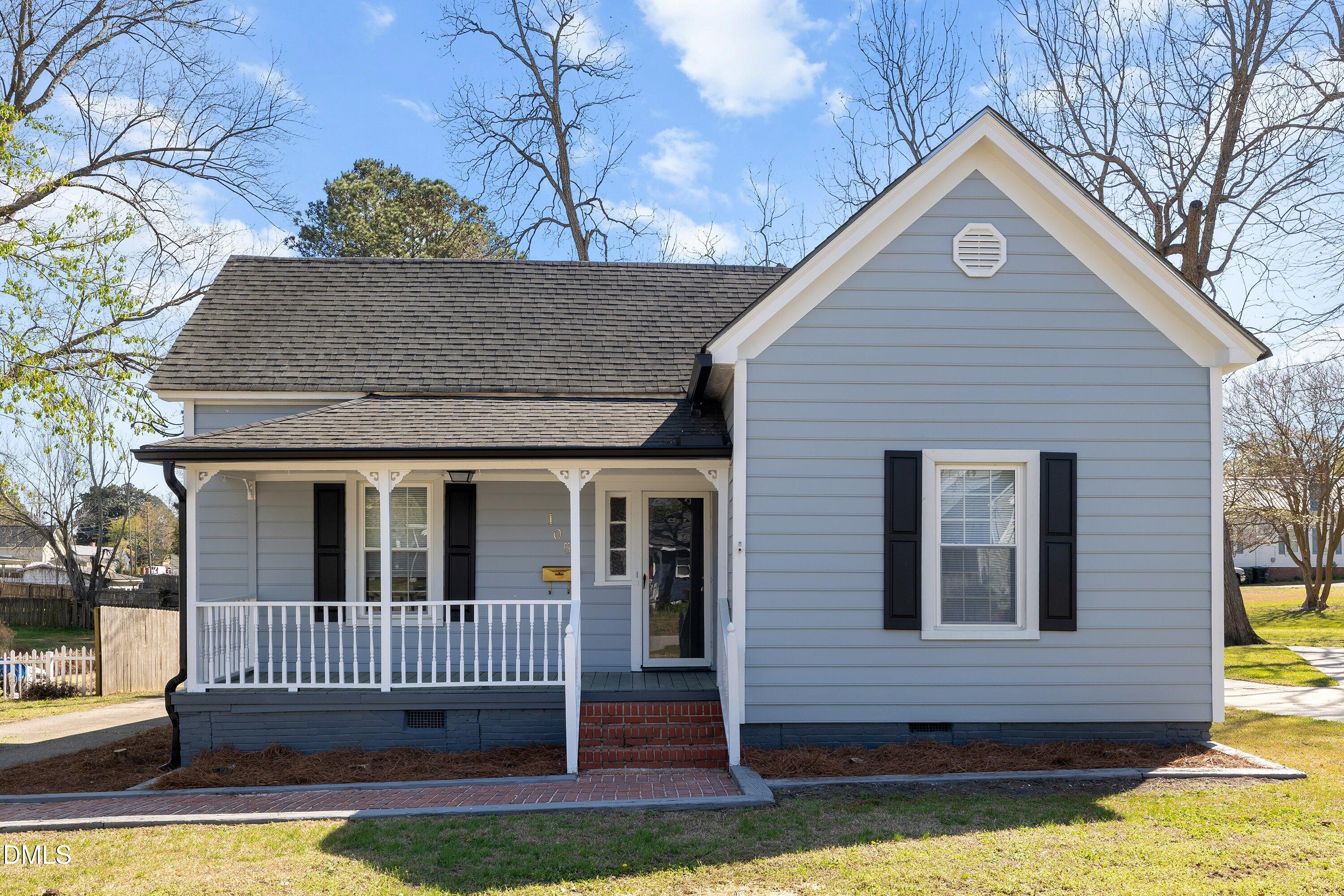 105 East I Street Erwin, NC 28339 - Photo 1 of 39 a front view of a house with a yard