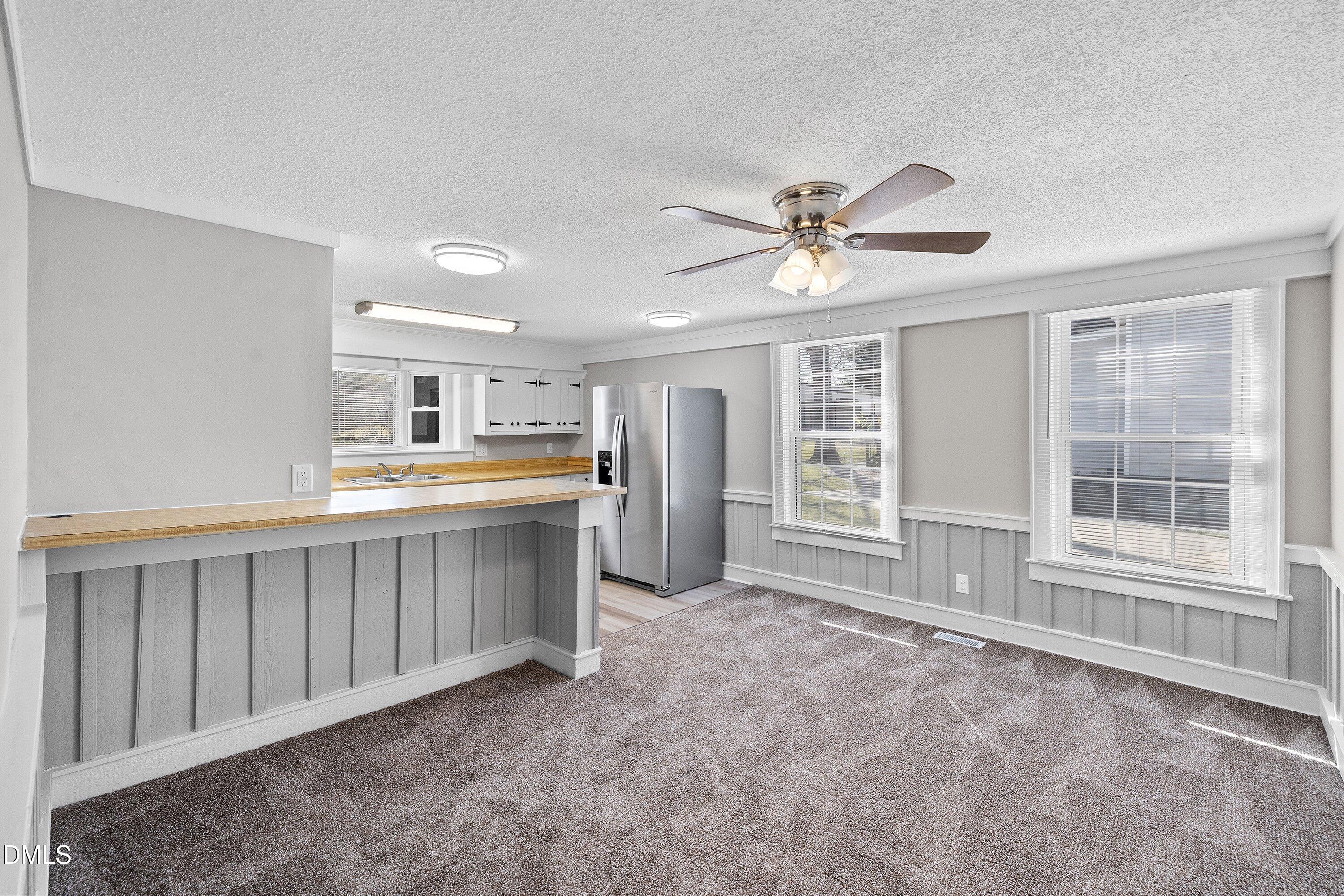 105 East I Street Erwin, NC 28339 - Photo 14 of 39 a large white kitchen with a window