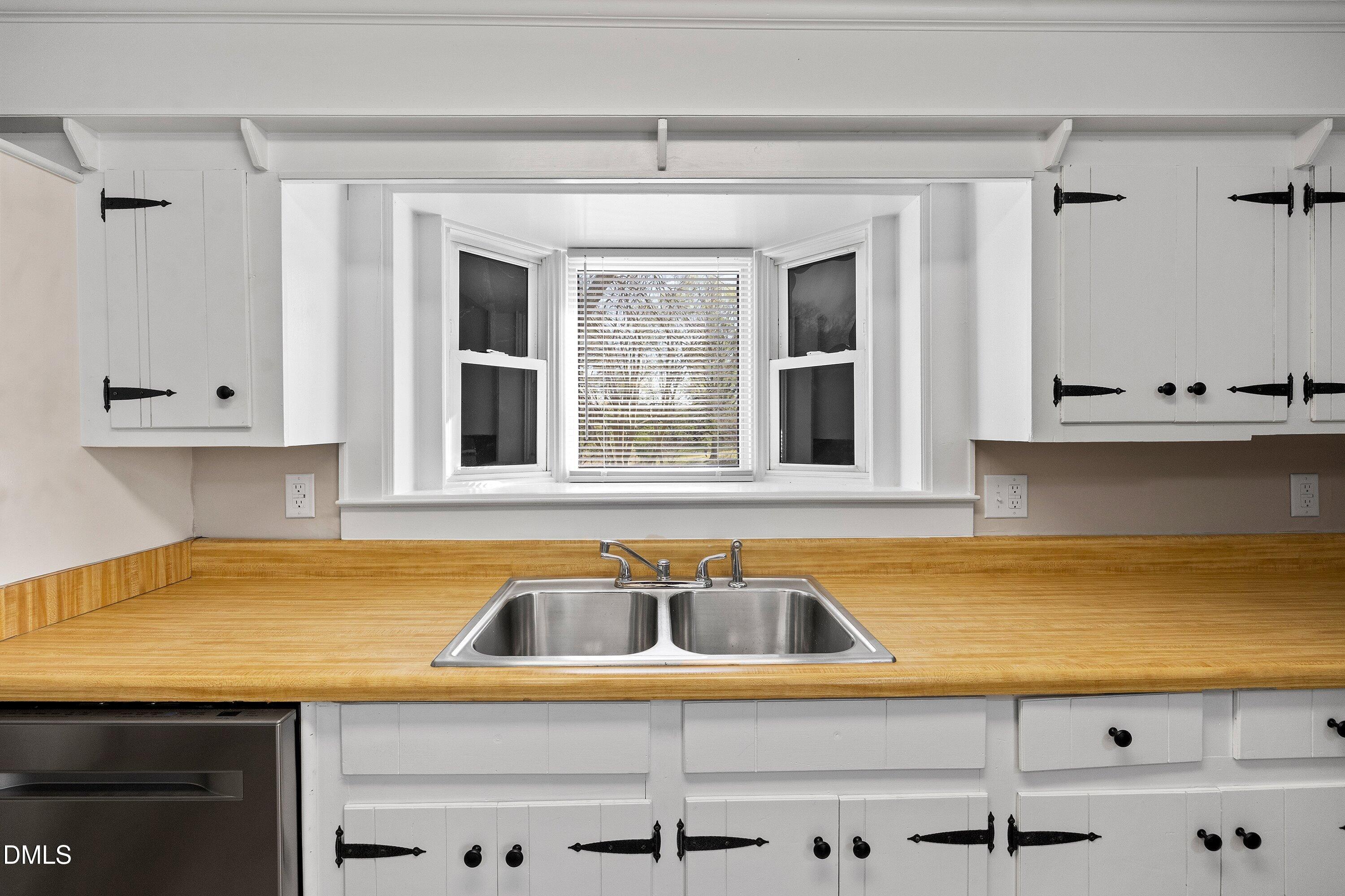 105 East I Street Erwin, NC 28339 - Photo 24 of 39 a view of a kitchen with a sink and cabinets
