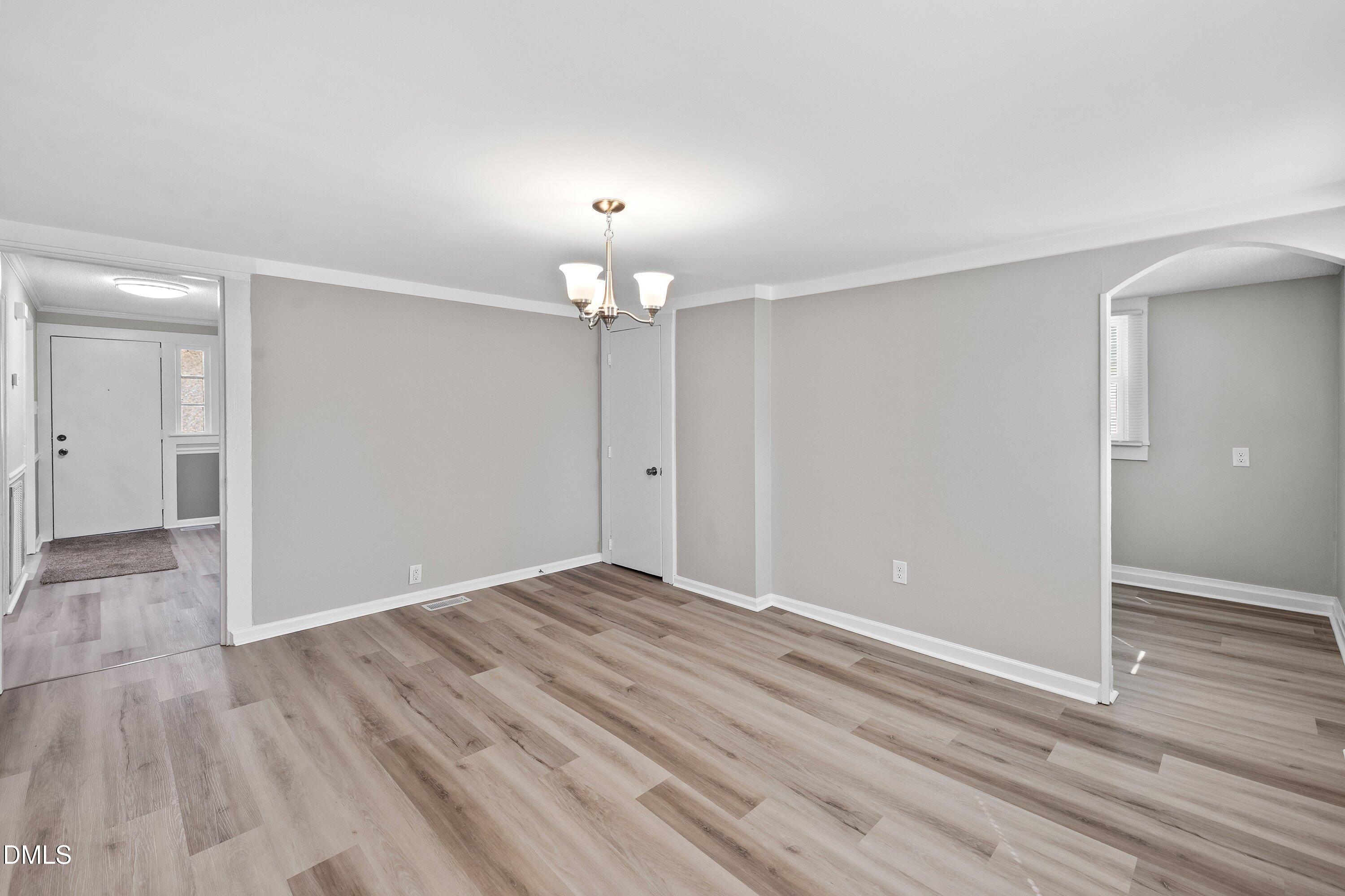 105 East I Street Erwin, NC 28339 - Photo 28 of 39 wooden floor in an empty room with a window