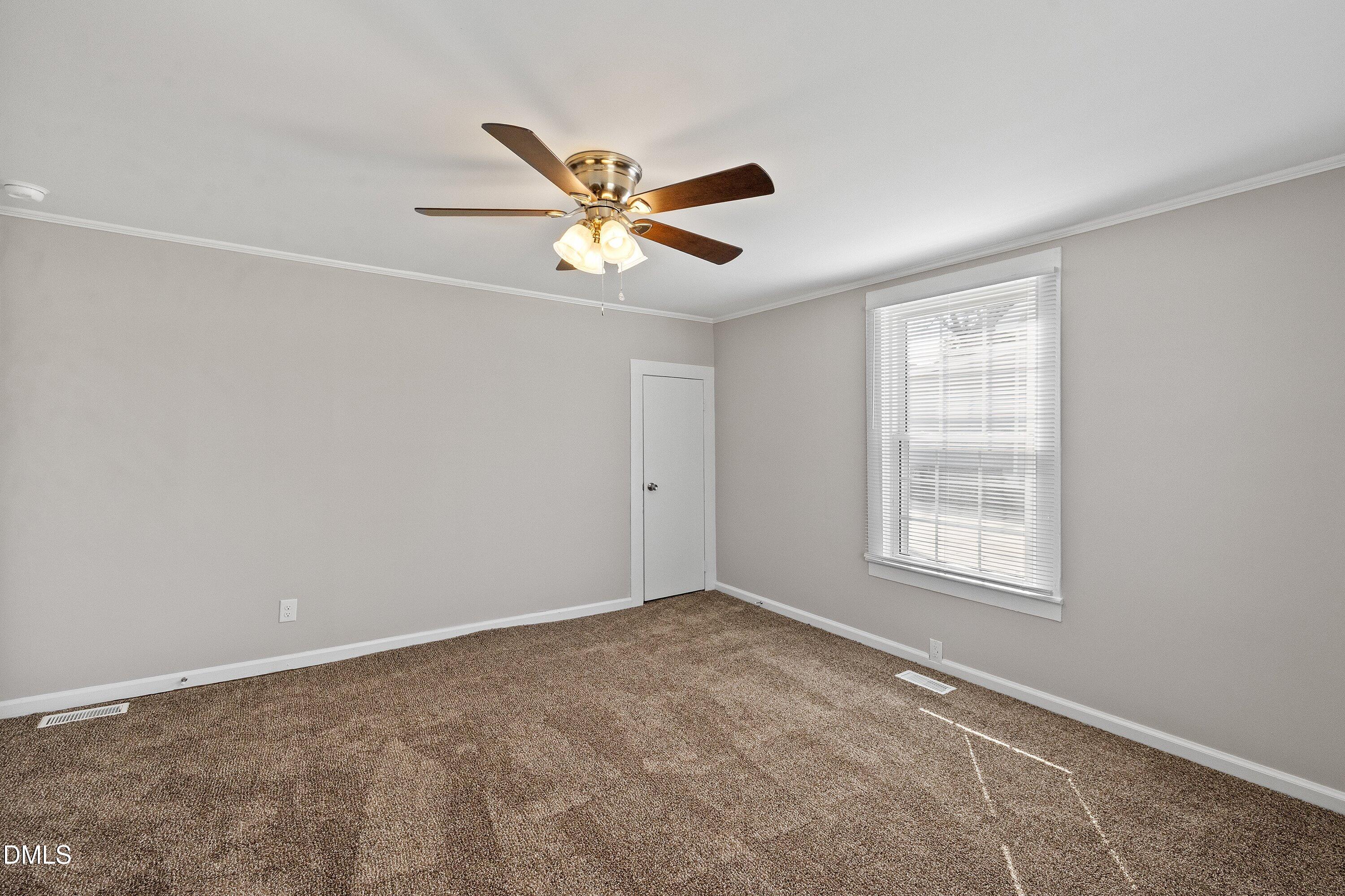 105 East I Street Erwin, NC 28339 - Photo 32 of 39 a view of an empty room with a window