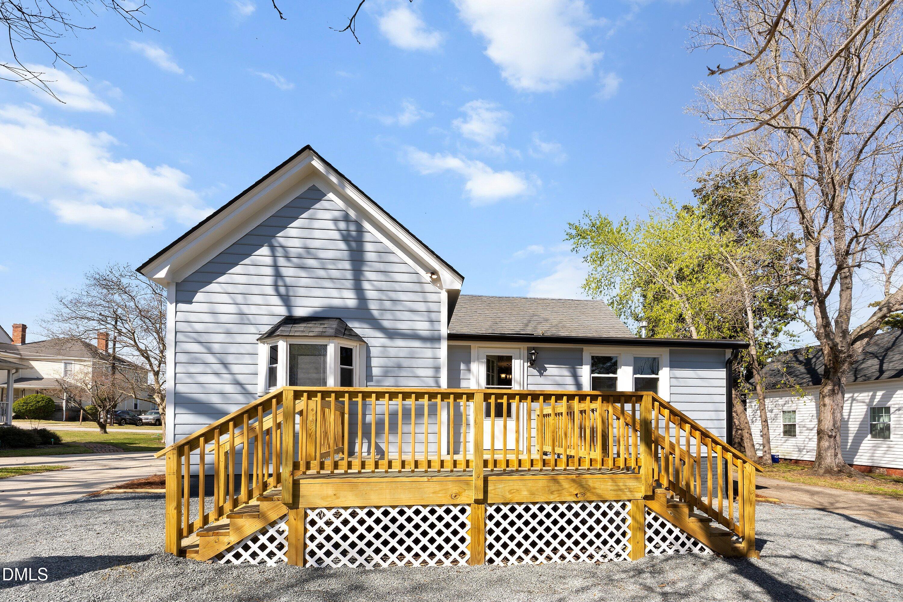 105 East I Street Erwin, NC 28339 - Photo 33 of 39 a view of a house with a wooden deck