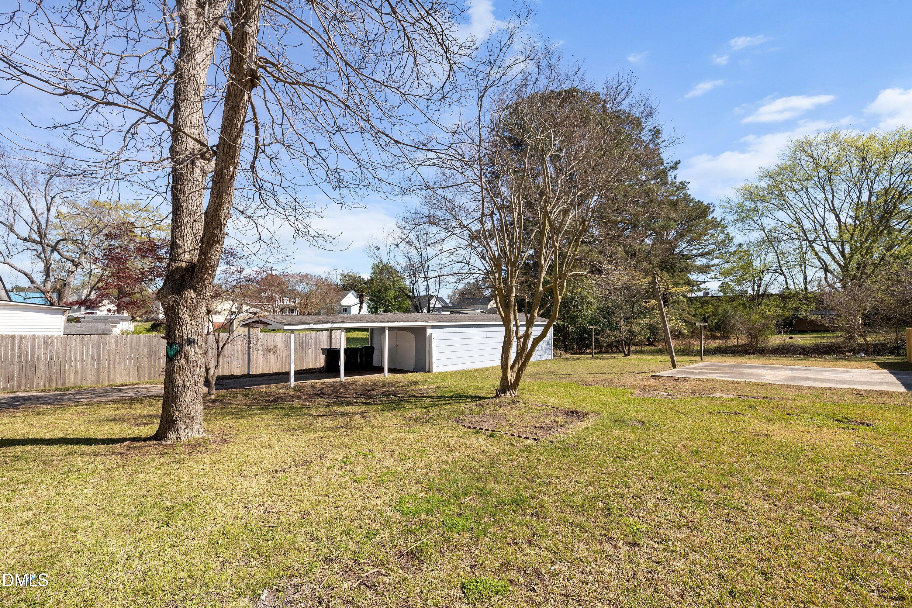 105 East I Street Erwin, NC 28339 - Photo 36 of 39 a view of a house with pool and trees