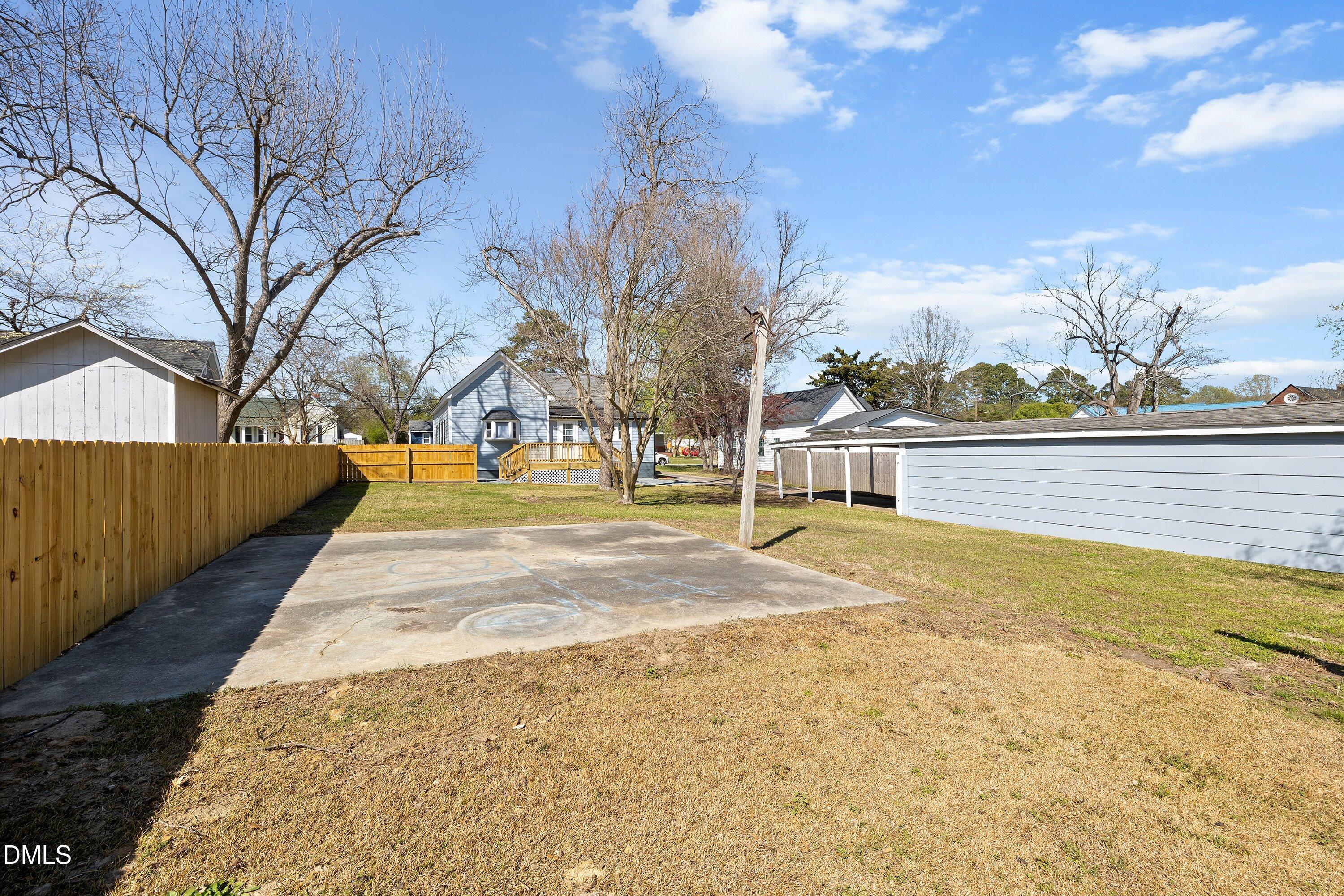 105 East I Street Erwin, NC 28339 - Photo 38 of 39 a view of yard with swimming pool and trees